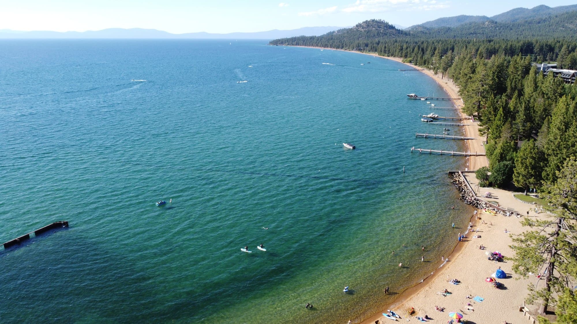 Aerial photograph of a turquoise cove at Lake Tahoe.